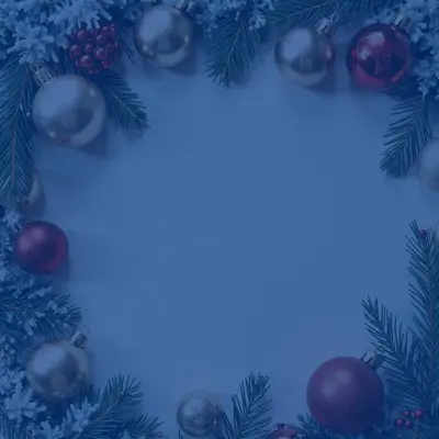 Christmas ornaments and pine branches arranged in a festive circular pattern.